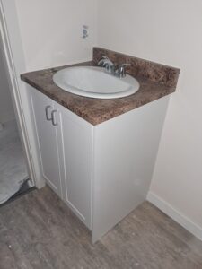 Alt=Bathroom vanity with countertop and under sink storage