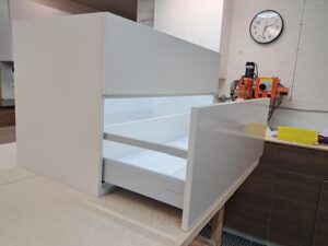 Alt=Custom bathroom vanity with modern design and drawers