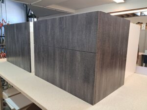 Alt=Custom built vanity cabinet with shelving and drawers