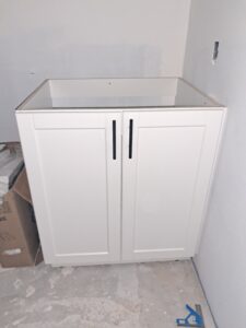 Alt=Small bathroom vanity with compact storage solution