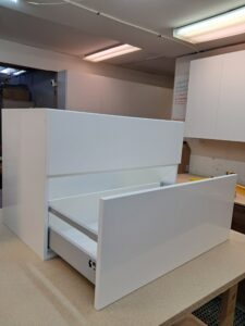 Alt=Wooden bathroom vanity with natural finish