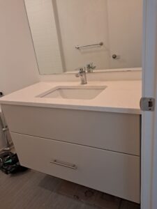 Alt=Custom floating bathroom vanity with MDF fronts